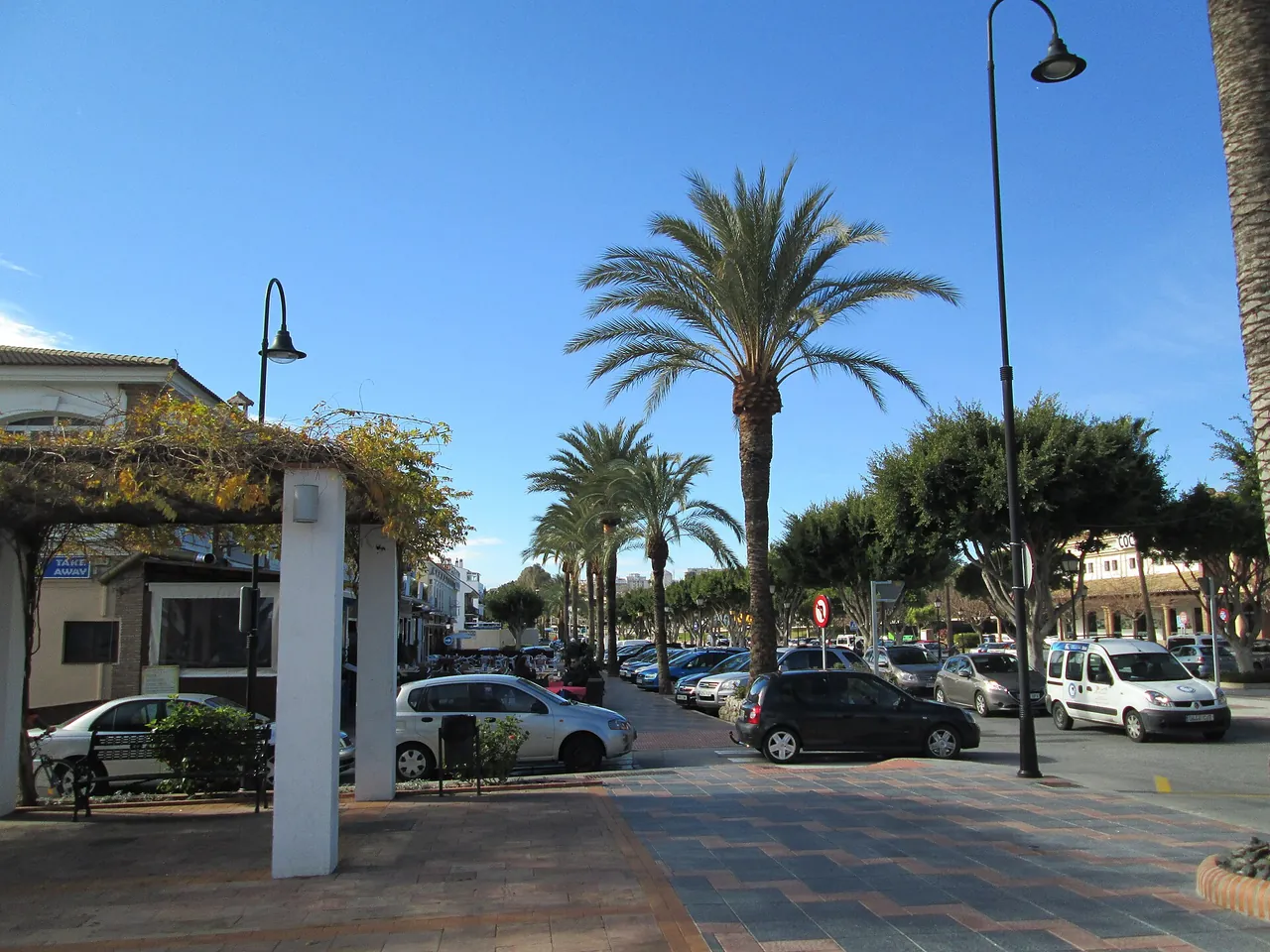 A palm-lined street in the centre of La Cala de Mijas