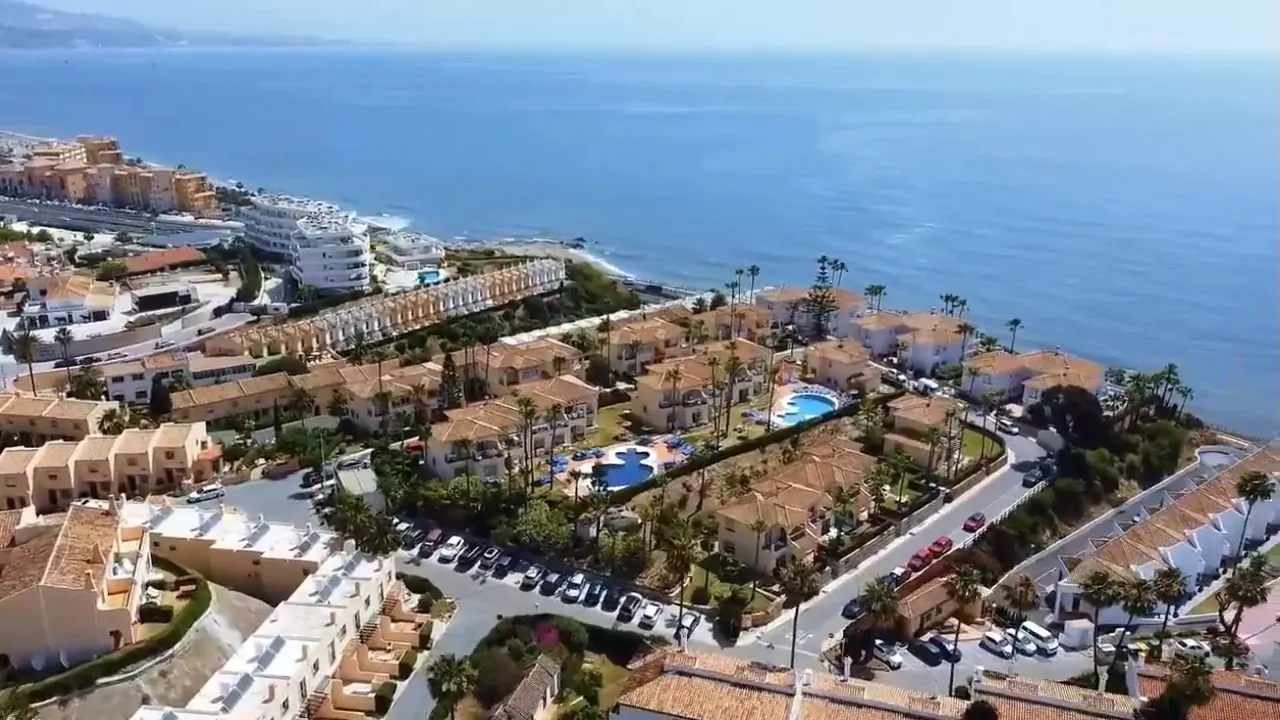 El Faro, Mijas Costa: homes with pools above the sea, from the air